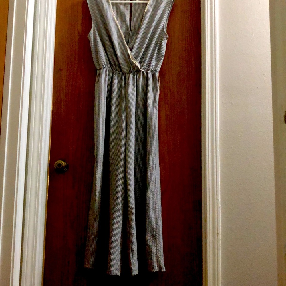 Sleeveless striped jumpsuit size L